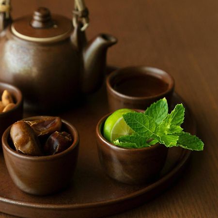Al Bustan Palace, A Ritz-Carlton Hotel Muscat Exterior photo A Japanese tea set