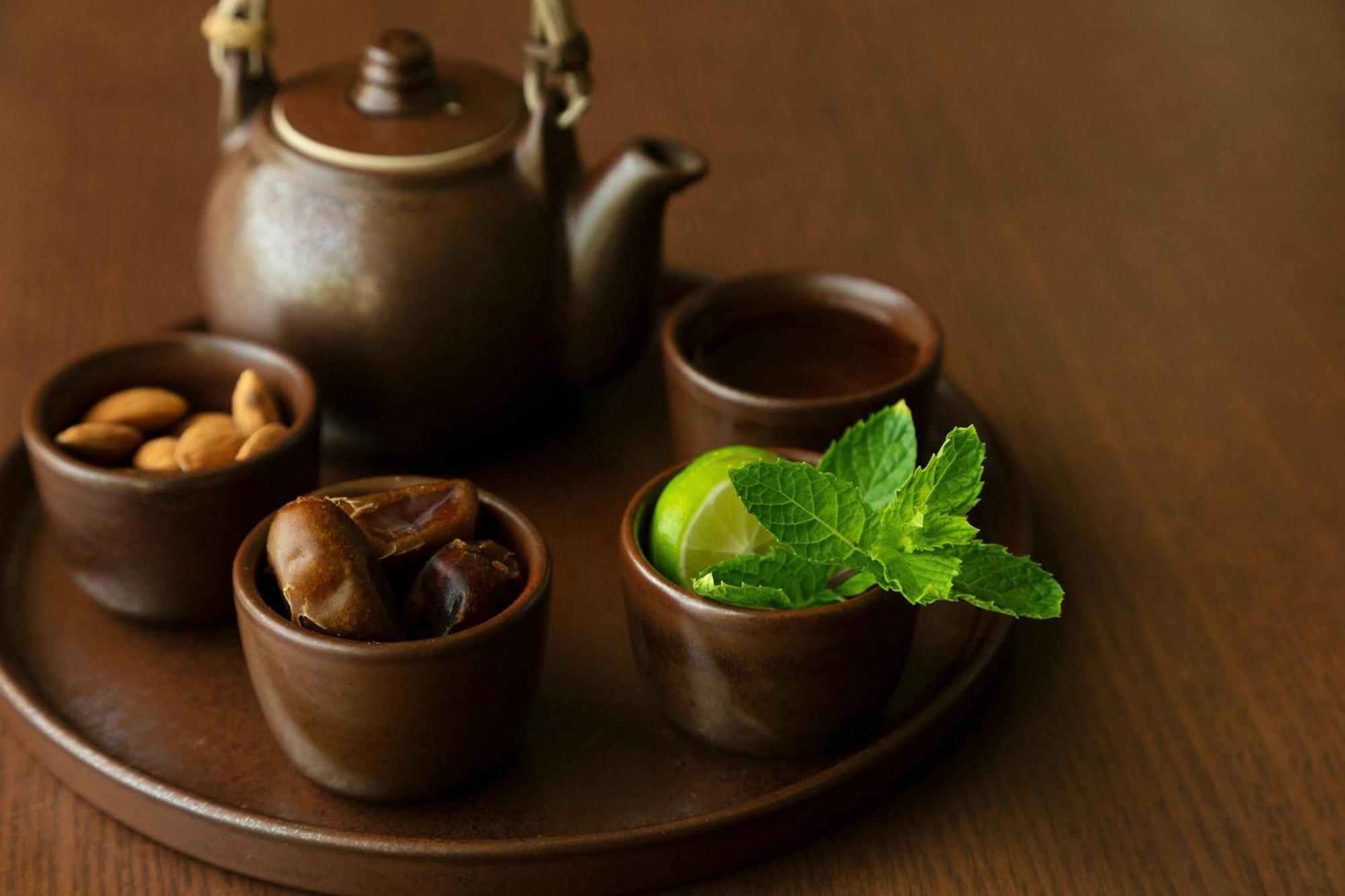 Al Bustan Palace, A Ritz-Carlton Hotel Muscat Exterior photo A Japanese tea set